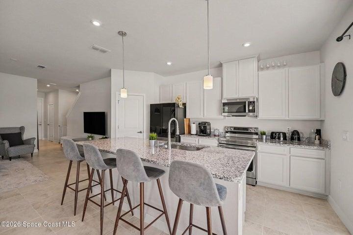 42' Timberlake cabinets with included stacked drawers. Granite countertops with farmhouse undermount stainless sink.
