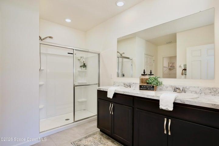 Owner's Ensuite with dual sinks, shower, private water closet, dual closets including a walkin in closet with built-ins.