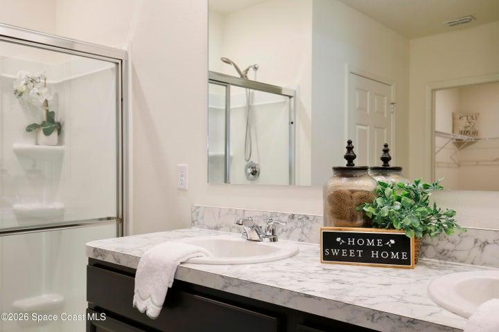 Owner's Ensuite with dual sinks, shower, private water closet, dual closets including a walkin in closet with built-ins.