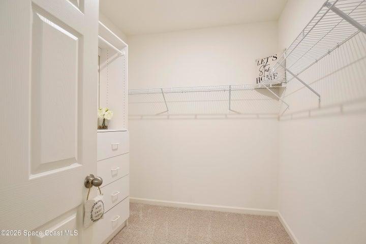 Walk-in closet with built-ins.