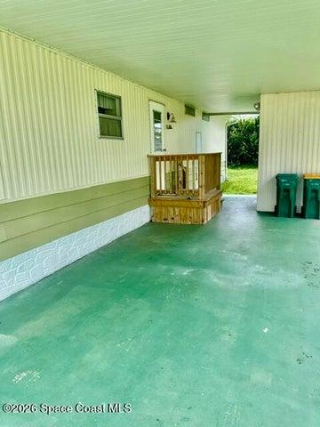 entrance under carport withshed