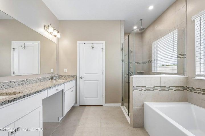 Luxurious and spacious primary bathroom.