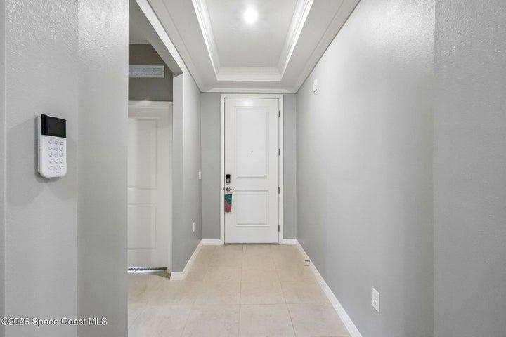 Front entrance hall with two bedrooms & guest bath.
