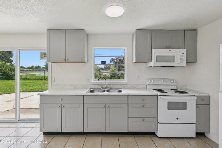 Bright Kitchen Overlooking Oversized Backyard