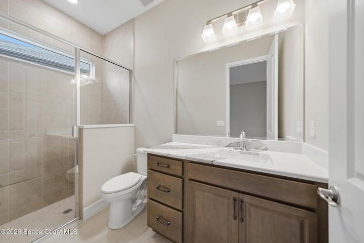 downstairs second primary/guest suite bathroom