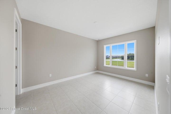 upstairs bedroom with walk in closet