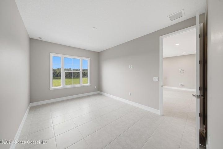 upstairs bedroom with walk in closet