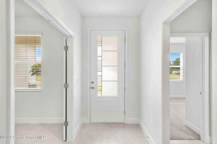 Metareesa Entryway with tile floors throughout
