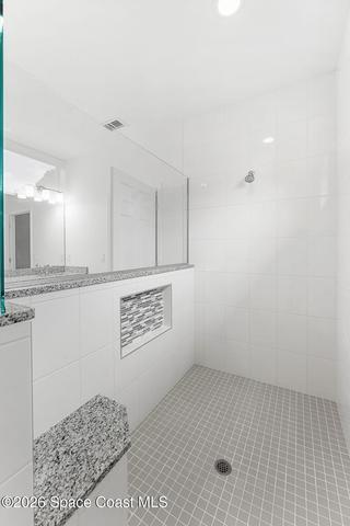 Oversized tiled walk in shower in the Primary bathroom.