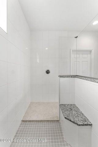 An added shower bench in the Primary Bathroom.