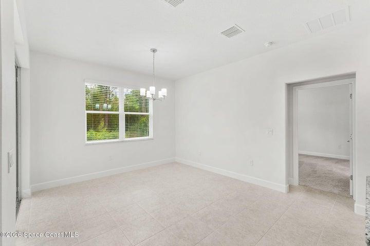 The Primary Bedroom sits just off the Kitchen and Nook.