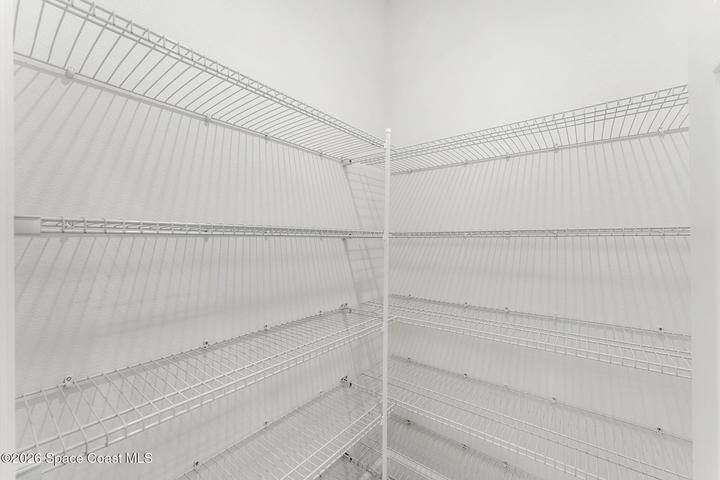 Walk in pantry with plenty of storage located in the kitchen.