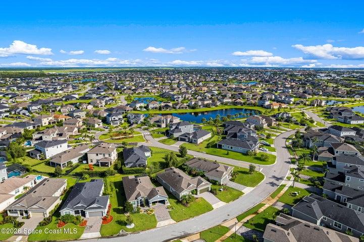 Aerial view showcasing the home’s front elevation and spacious property