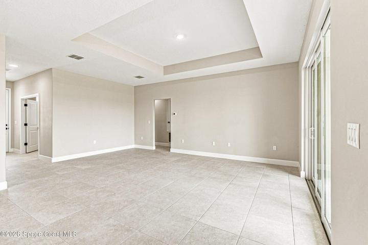 Great Room with featured tray ceilings