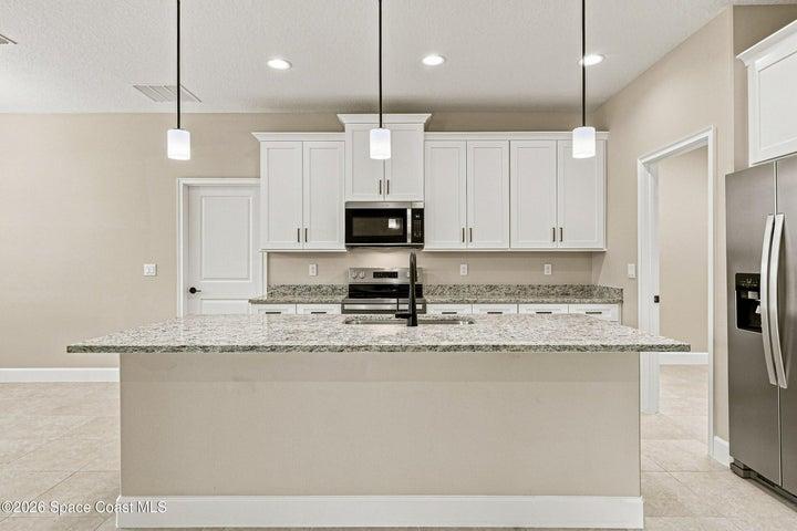 An oversized kitchen island great for hosting and entertaining.