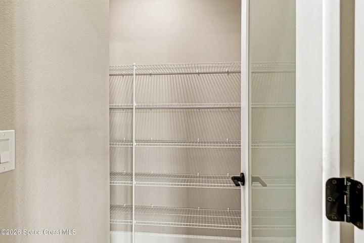 A walk-in pantry with plenty of extra storage!