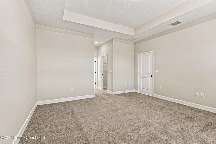 Primary suite with tray ceilings.