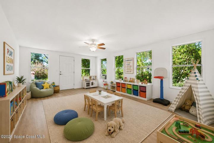 The large sunroom provides endless possibilities for a home office, playroom, gym, or additional living area.