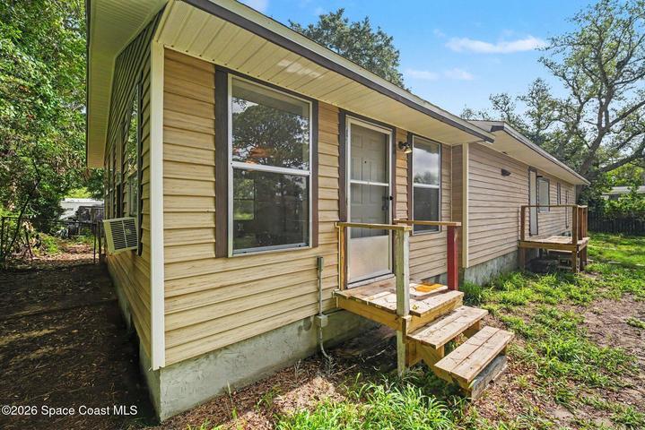 New Steps! Privately fenced spacious backyard with spectacular rocket launch views.