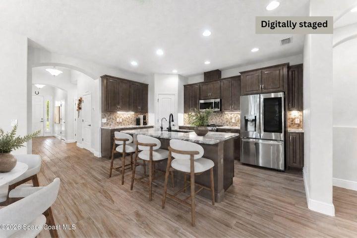 Well-appointed kitchen with ample cabinetry and counter space