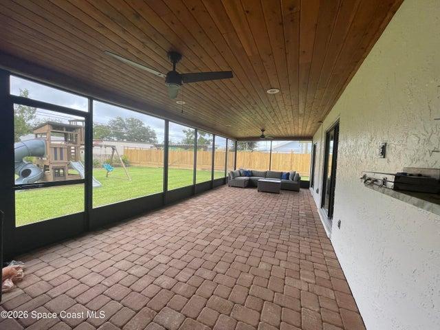 serene spacious porch and fully fenced back yard