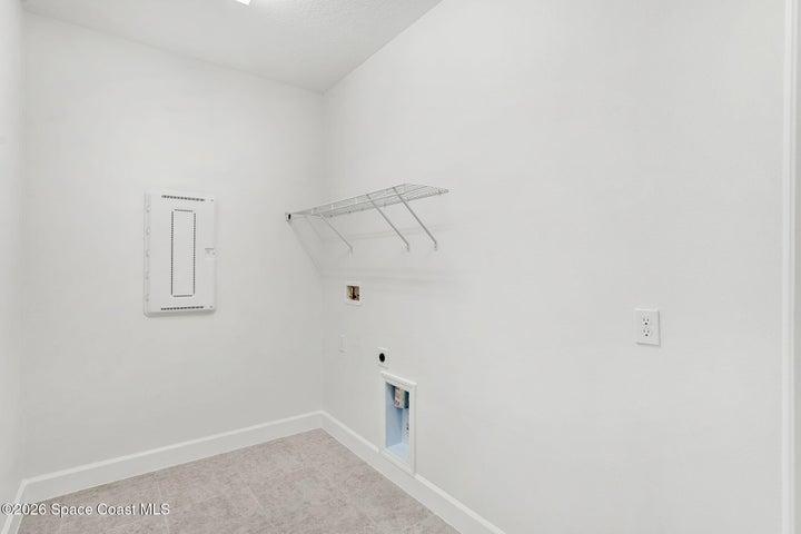 In home Laundry Room with washer and electric dryer hookups.