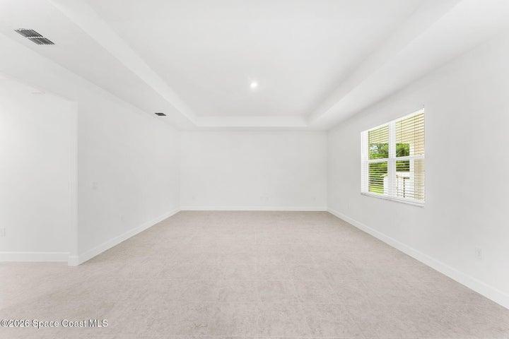 Great Room with tray ceilings and tile throughout