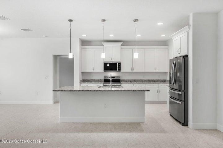 The oversized island is perfect for hosting and gathering!