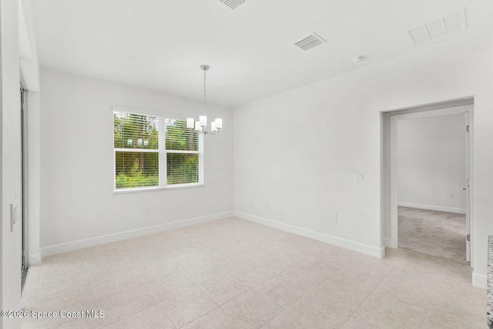 The Primary Bedroom sits just off the Kitchen and Nook.