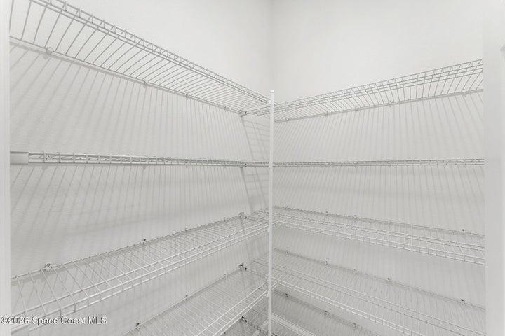 Walk in pantry with plenty of storage located in the kitchen.