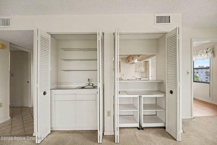 Storage in Living Room with passthrough to Kitchen