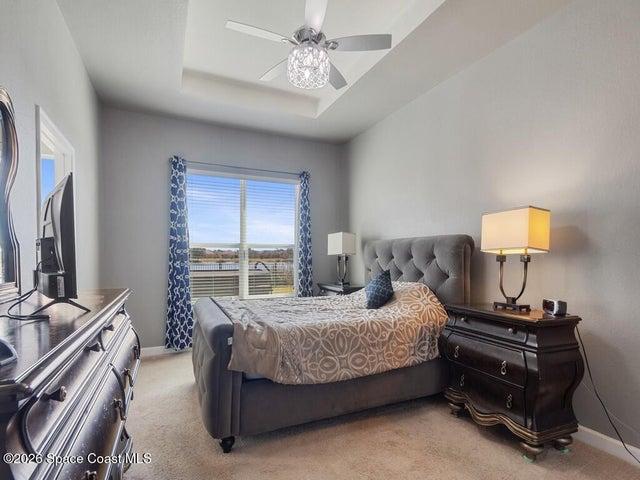 Tray ceiling with a decorative ceiling fan featuring crystal accents