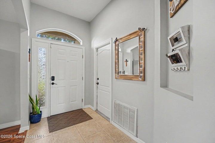 Bonus Room with Front Window to the Right After Entering Home. 2-Car Garage to the Left After Entering Home.
