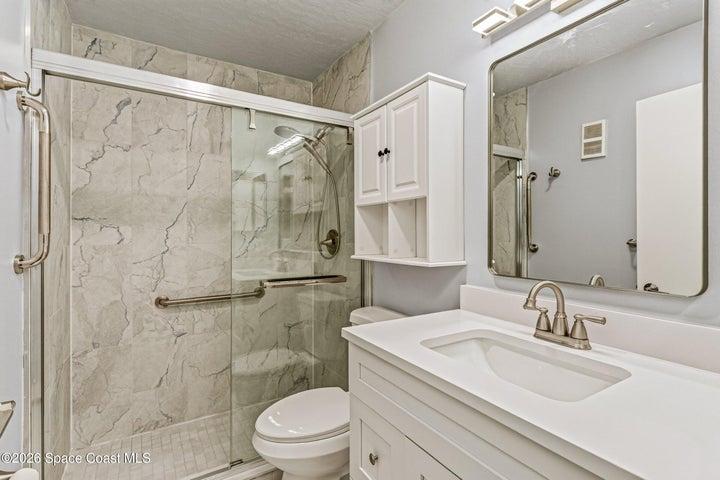 Full remodeled bathroom! Gorgeous floor to ceiling tile, large walk-in shower and sliding easy step entry
