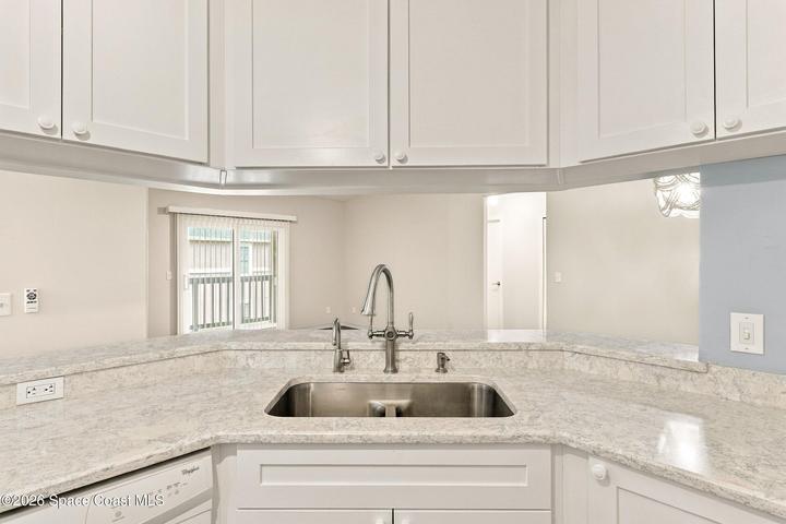 Kitchen view to living and dining