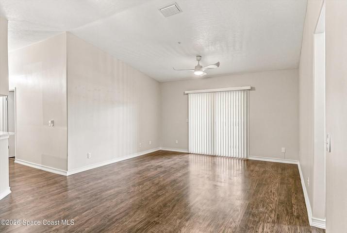 Living space and throughout featuring water proof flooring.