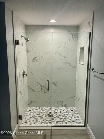 Shower door panel on master shower included