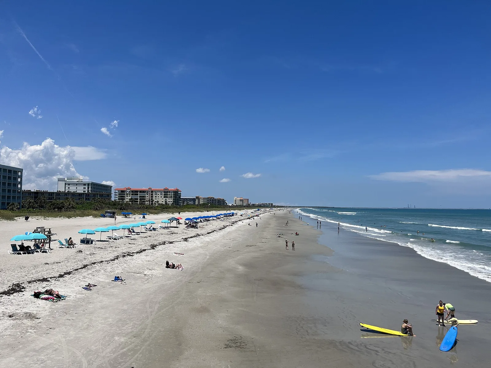 A busy beach day on the wide sand of Cocoa Beach