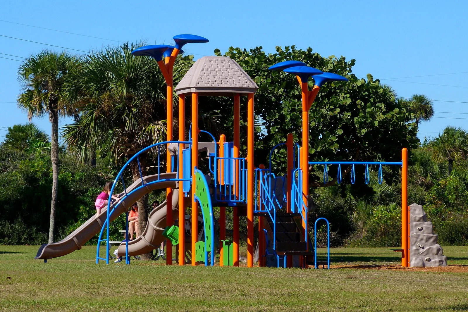 A colorful playground under palms in Cocoa Beach