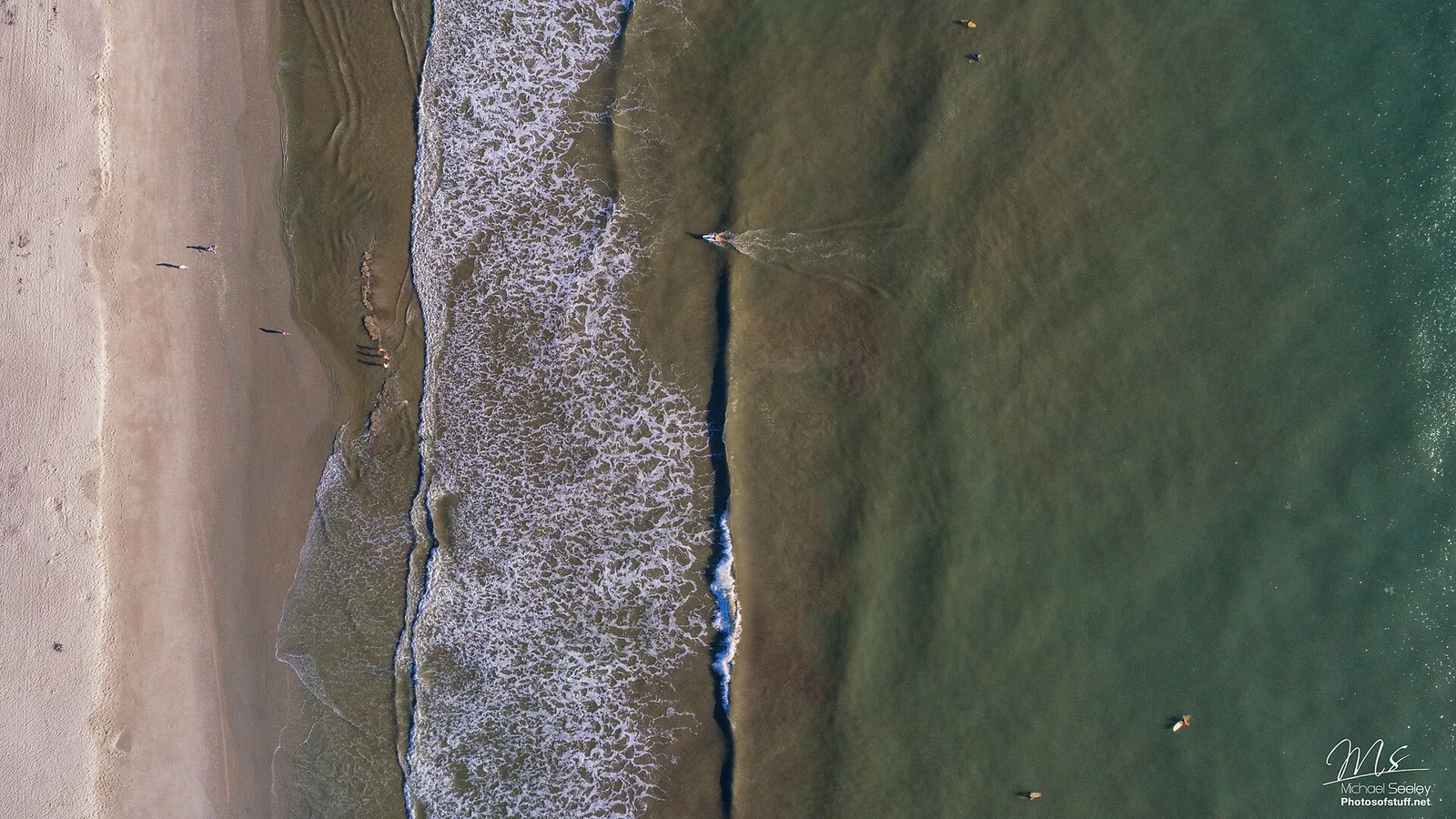Surfers off Indian Harbour Beach seen from above