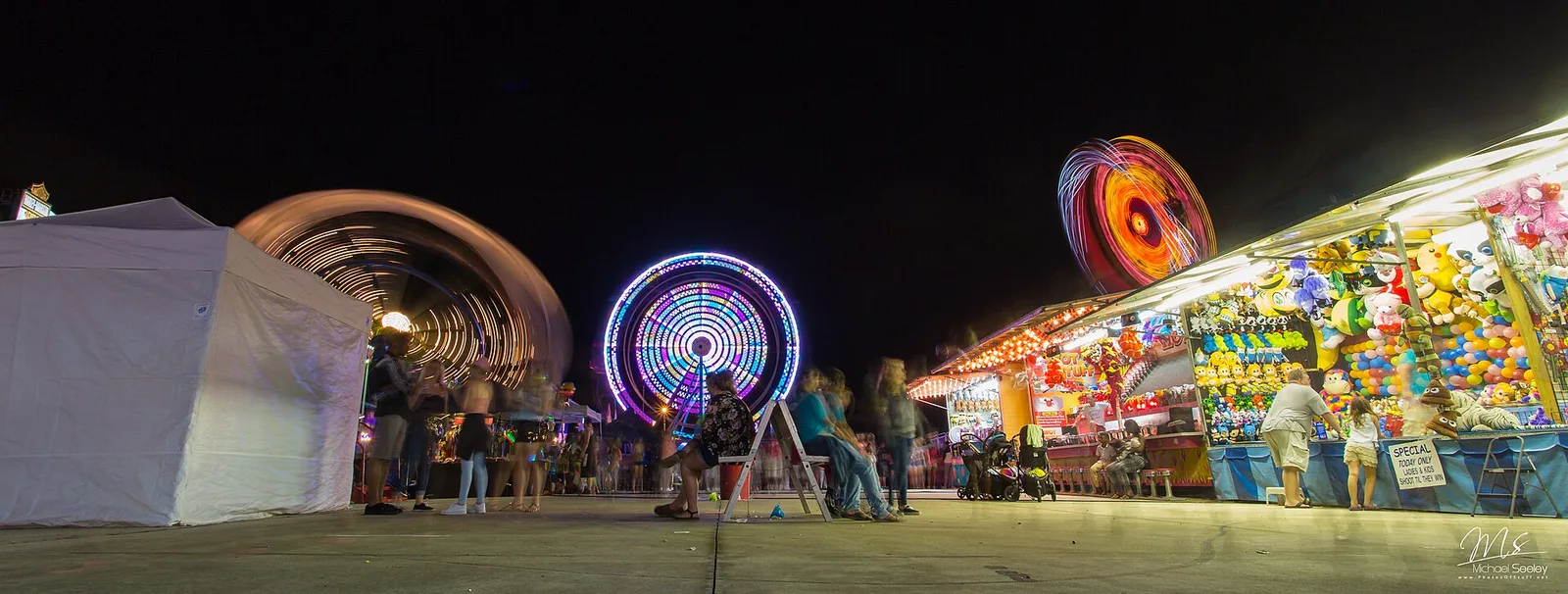 Rides lit up at night at the Palm Bay Fair