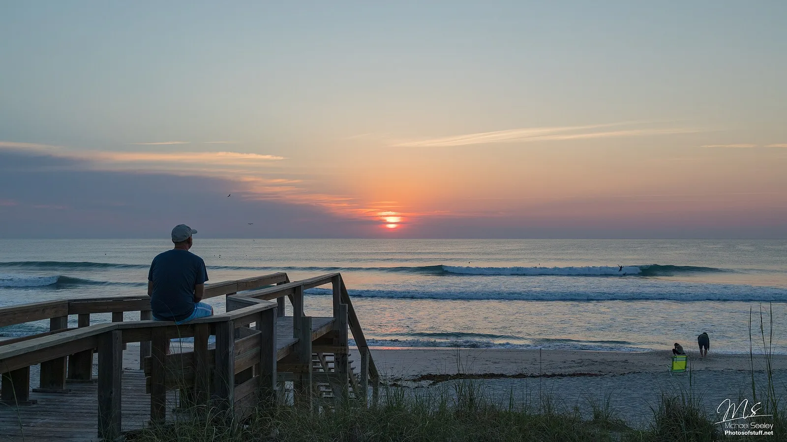 Watching the sunrise from a dune boardwalk in Satellite Beach